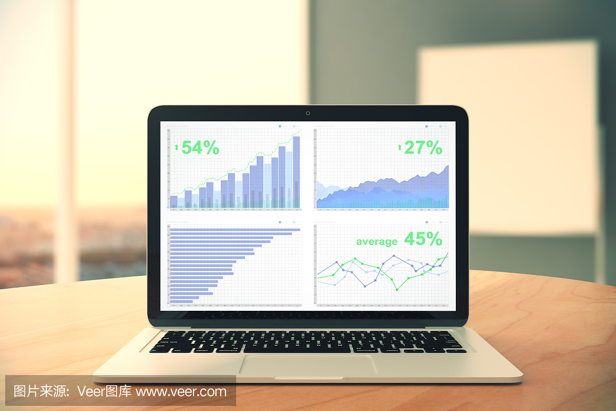 业务图表在笔记本电脑屏幕上的木桌上